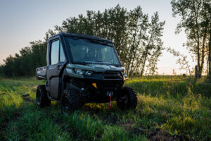 Side-by-side sitting in a field